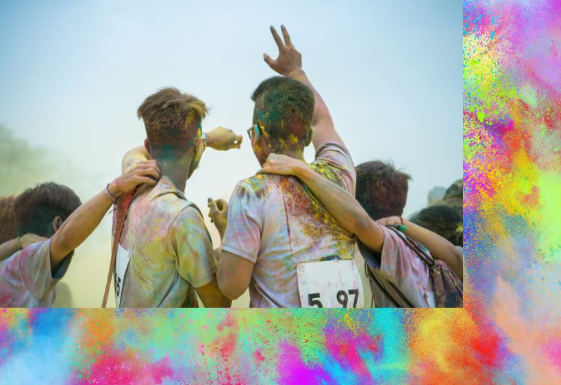 Image of runners covered in colour run powder