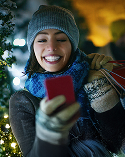 woman looking at cell phone