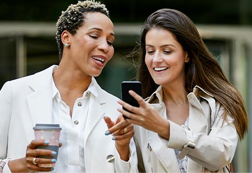 two people looking at a mobile device