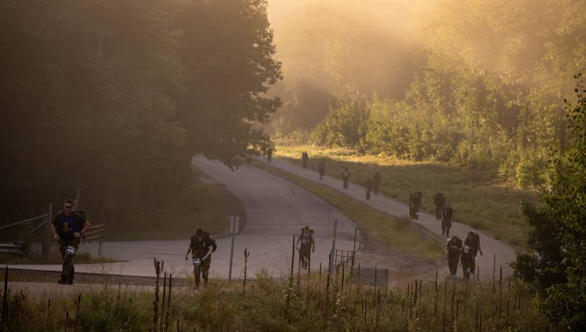 people running up a hill