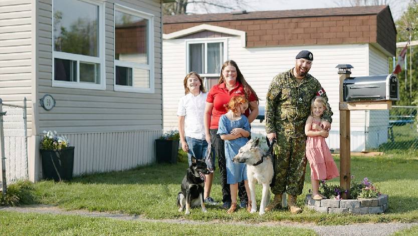 Family in front of house