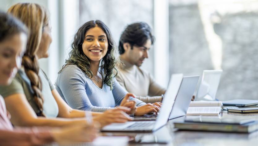 woman on laptop smiling