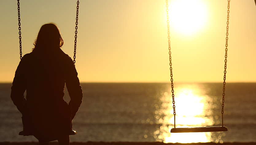 woman alone on swings