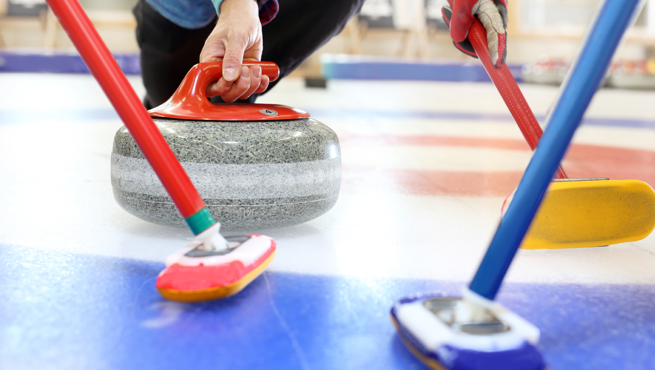 curling rock and brooms