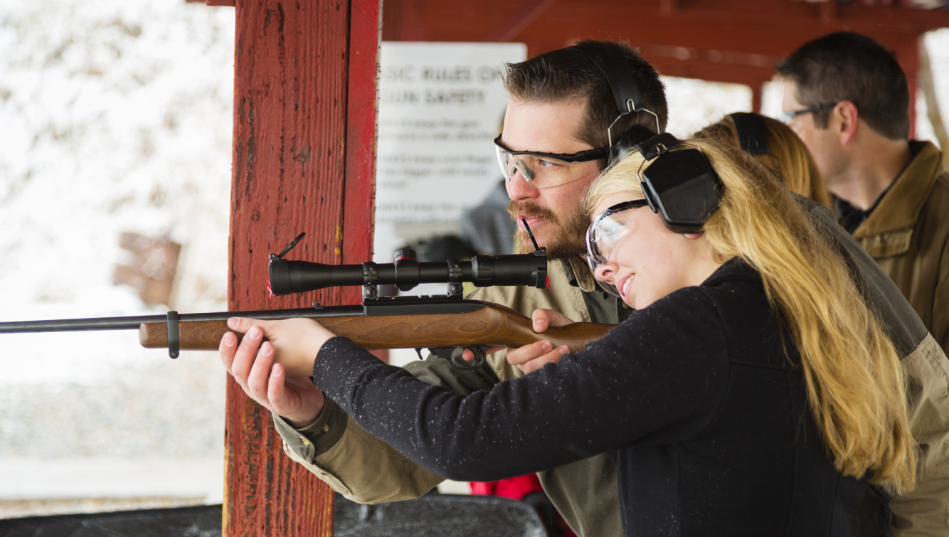 woman pointing gun