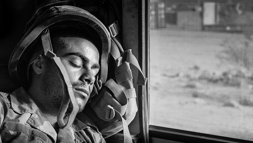 soldier resting on gear