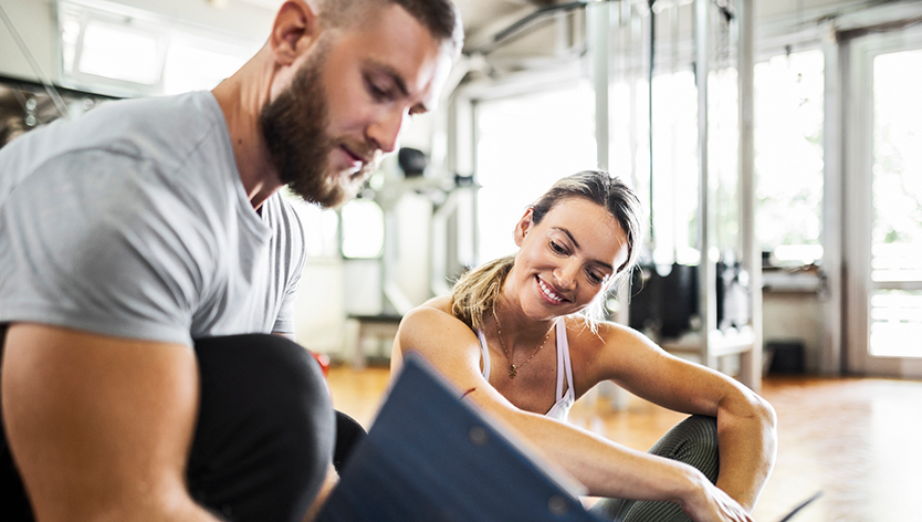 Personal trainer with his trainee