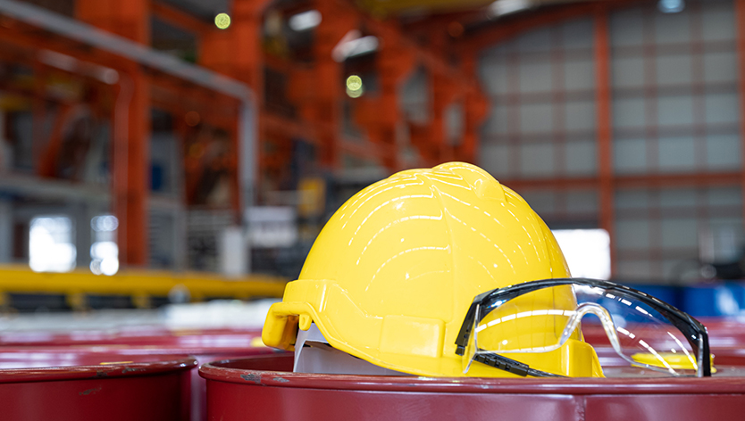 A construction helmet and pair of safety goggles