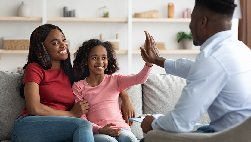 Mother and daughter speaking to psychologist