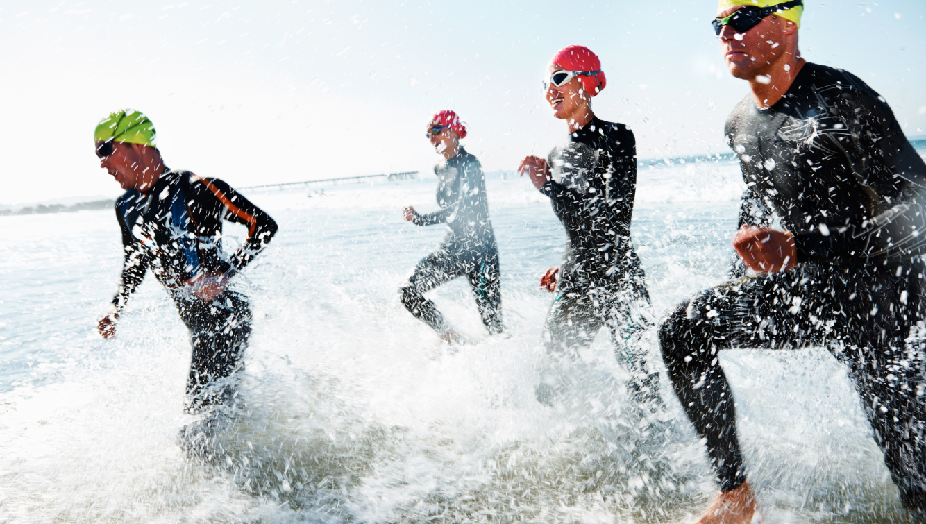 people running in water