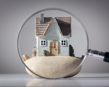 House under a magnifying glass