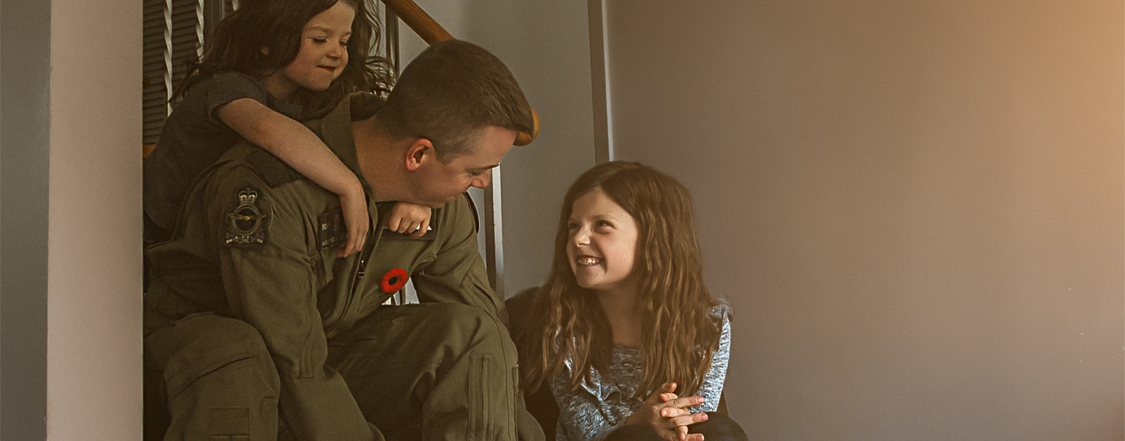 CAF member with his two daughters