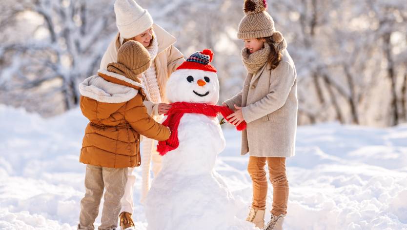 Family building a snowman