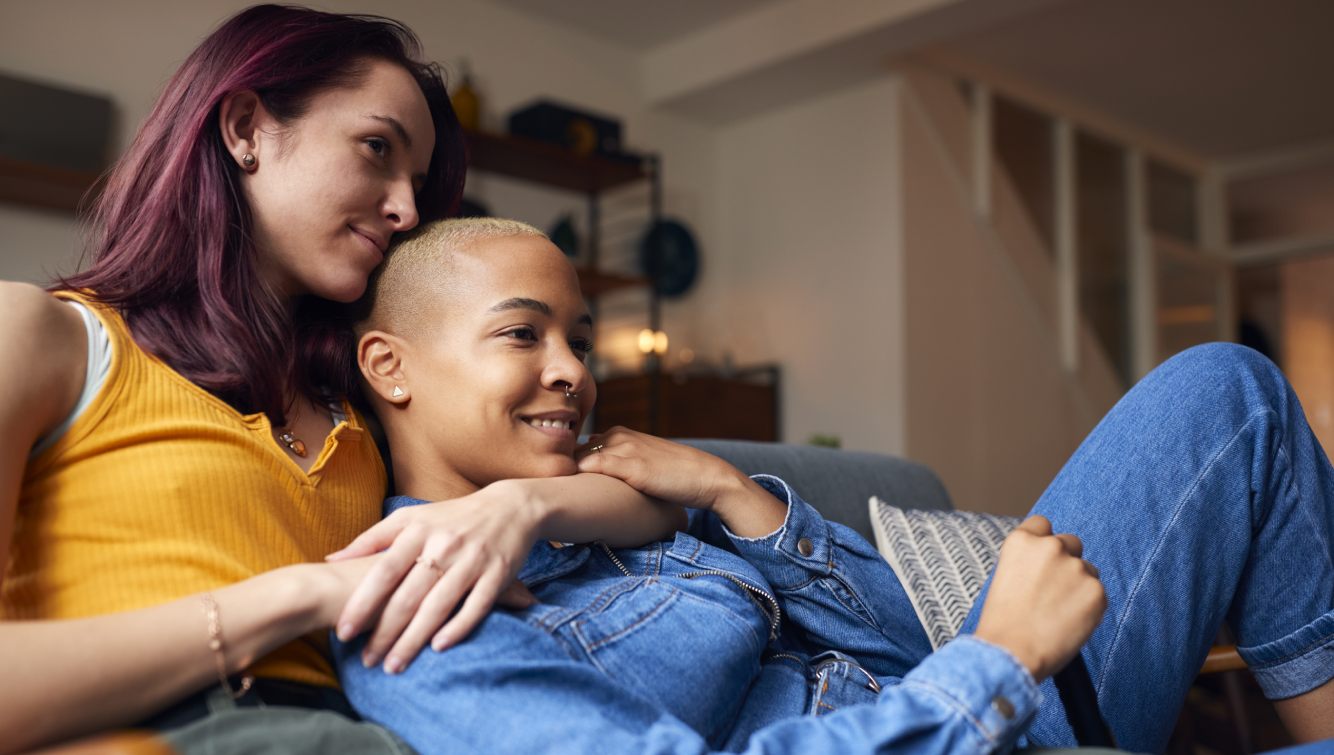 2 women on a couch