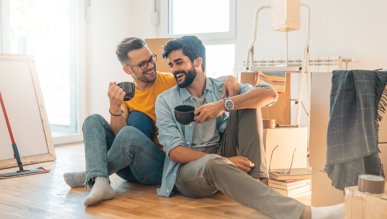 2 men on floor with boxes