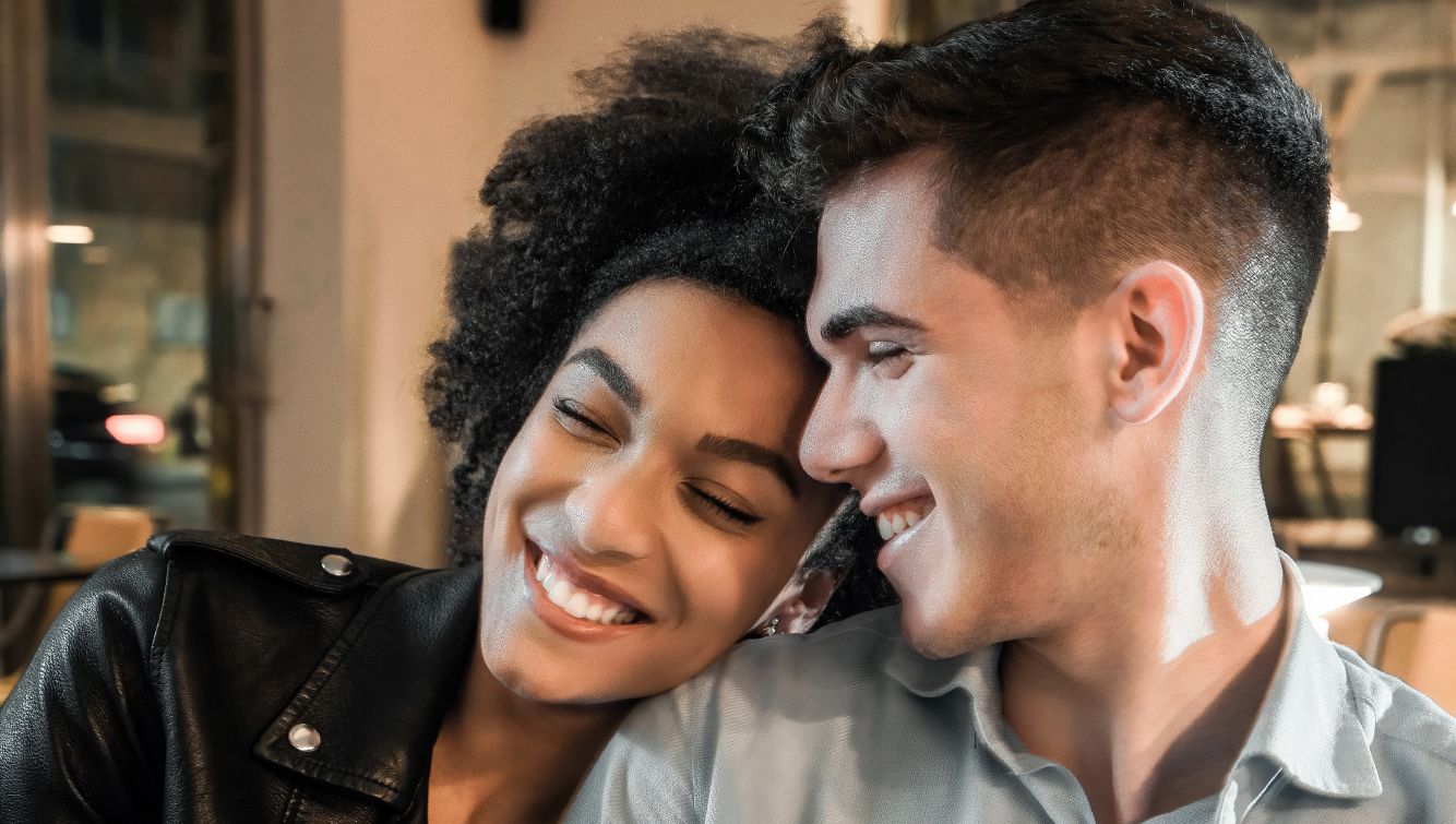 man and woman smiling