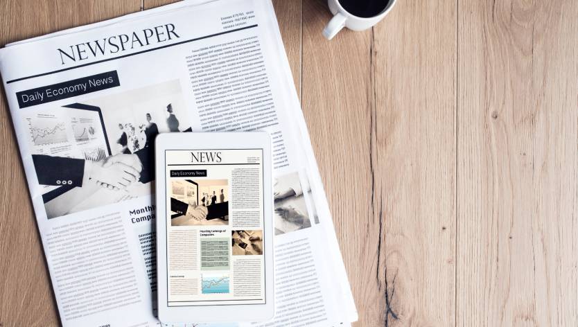 newspaper tablet and coffee cup