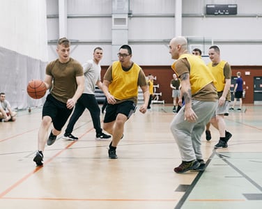group of military members playing basketball