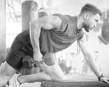 Man training and looking at his phone