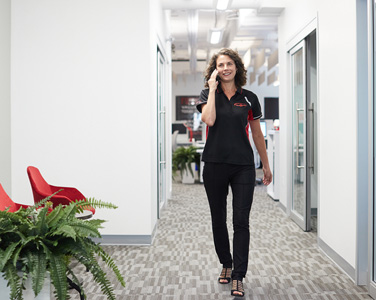 woman walking in office hallway