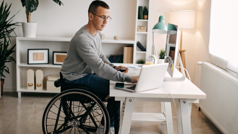 A man in front of a computer