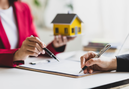 Hands signing documents