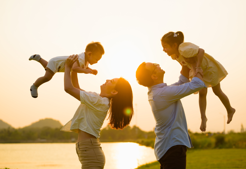 Family holding kids