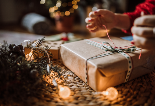 Hands opening a gift