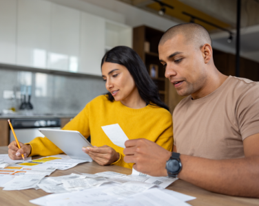 A couple looking at bills