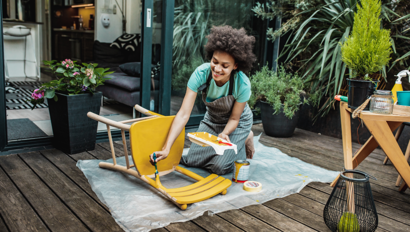 Woman painting a chair