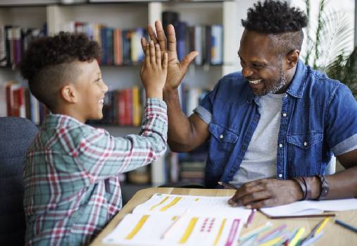 Father and son high five