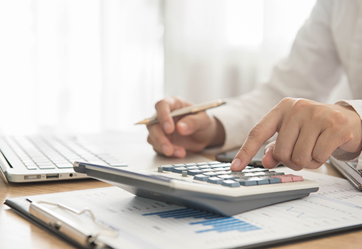 Person calculating and budgeting