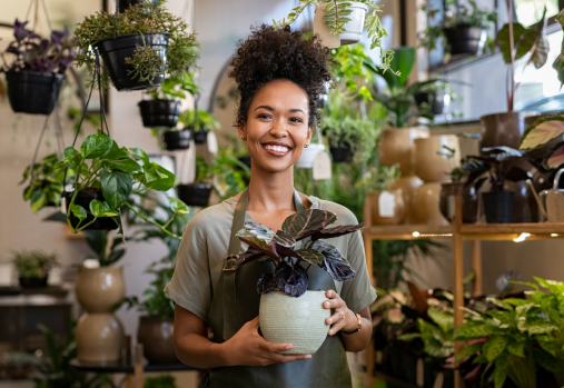 A woman holding a plant