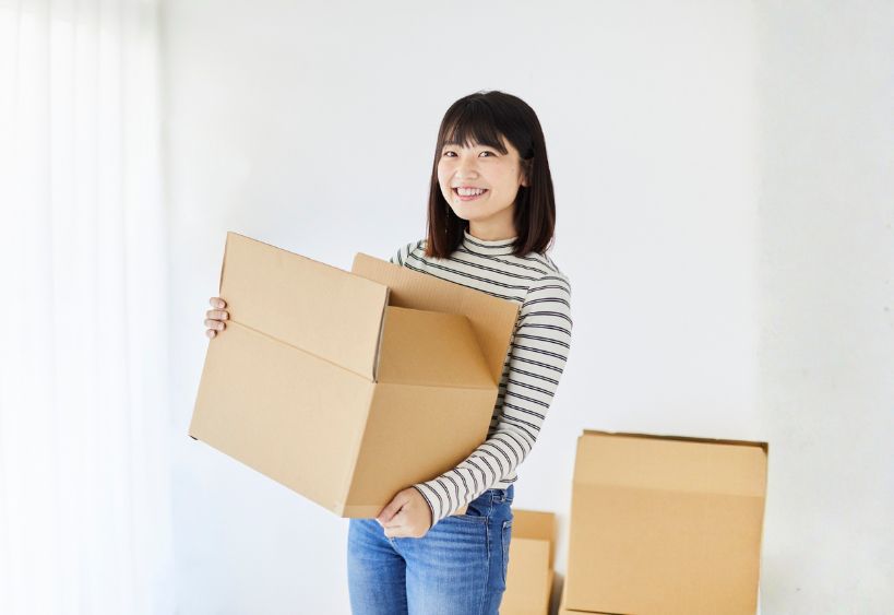Woman moving boxes