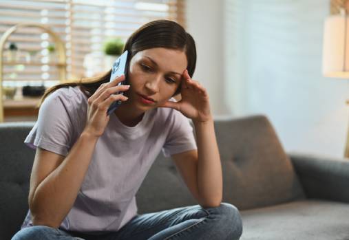 woman on phone looking off to side