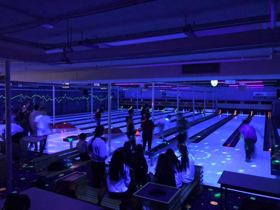 A picture of partons enjoying glow bowling at the Greenwood Bowling Center.