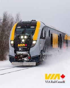 Train driving through snow, VIA logo