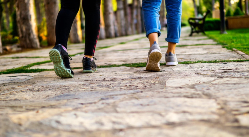 Close-up of the shoes of two people walking